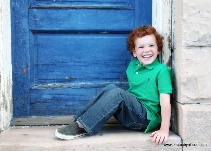 child_boy_blue_door_green_shirt.jpg