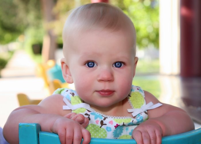 baby_in_blue_chair.jpg