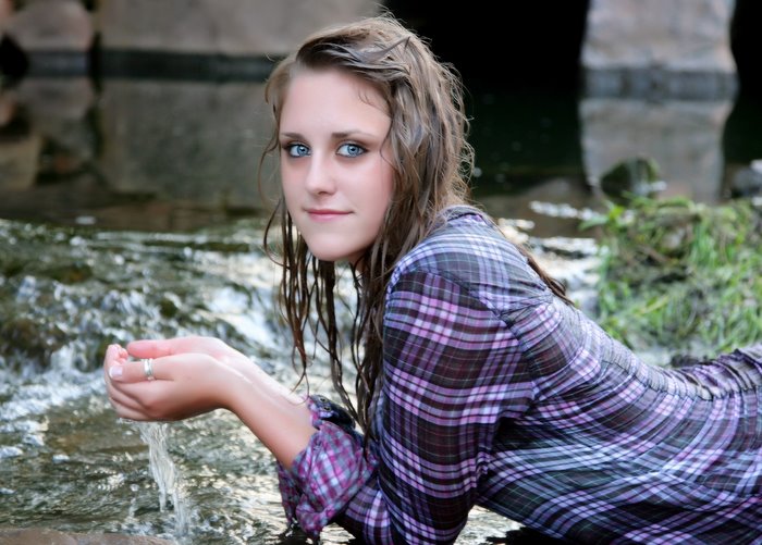 high_school_senior_girl_purple_shirt_in_water_bridge.jpg