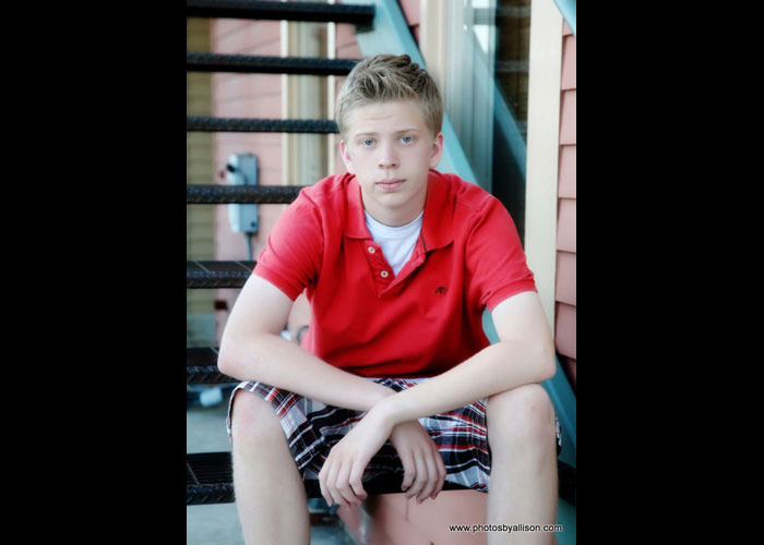 senior_boy_sitting_steps_red_shirt.jpg